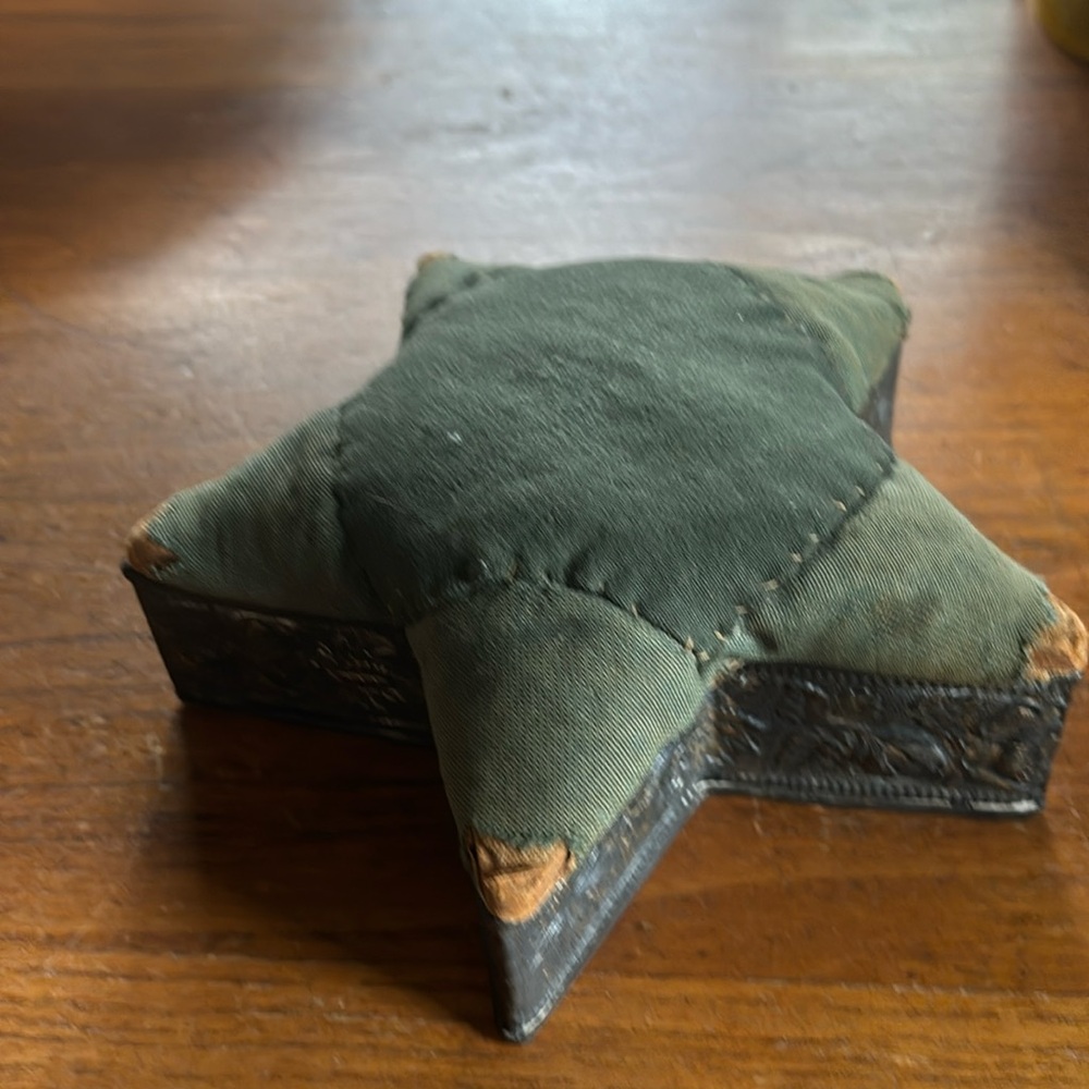 Antique star shaped embossed rose design metal base green fabric lid storage box